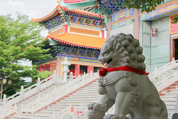 istock stone statue and chinese temple background 483130284