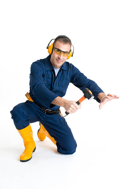 istock Portrait of an handsome Worker using a hammer 483134365
