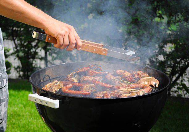 istock Man preparing a food on the grill. 483134712