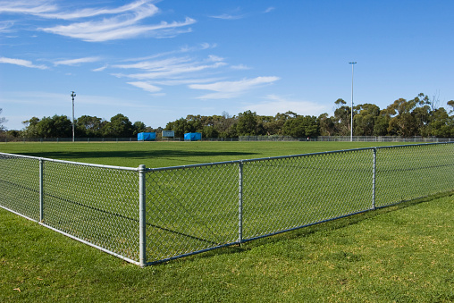 Horizontal view of an empty sports oval. Other related images: