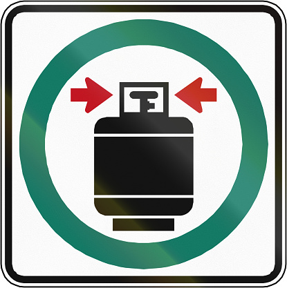 Regulatory road sign in Quebec, Canada - Close and seal gas tanks.