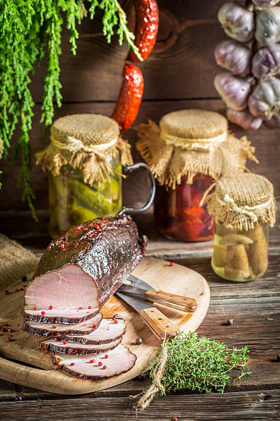 istock Rural smokehouse with ham and herbs 483137273