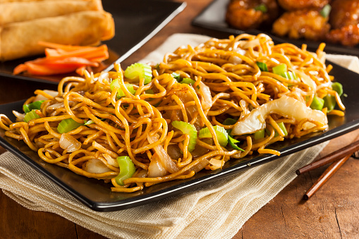 Asian Chow Mein Noodles with Vegetables and Chopsticks