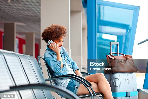 Happy Girl On Mobile Phone Stock Photo - Download Image Now - Airport, Smiling, Women