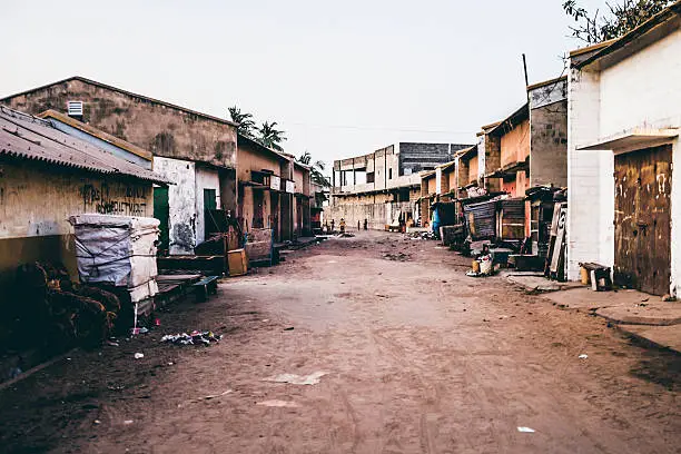 West African town. Empty markets street at evening time.