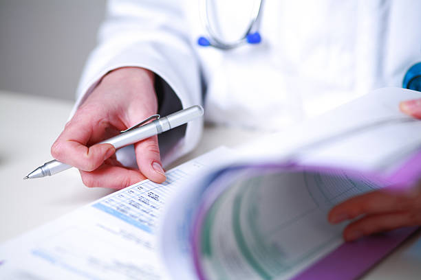 istock female doctor looking a medical file 483138601