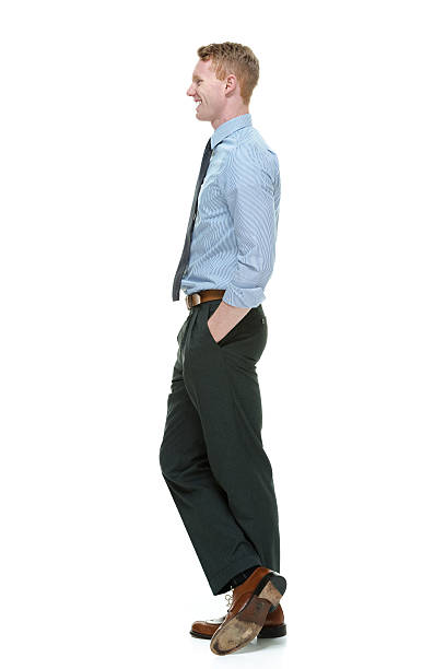 istock Smiling businessman standing and looking away 483139017