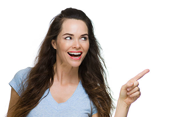 istock Happy Woman pointing at copy-space. 483140455