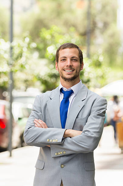 istock Handsome successful businessman professional in grey suit posing for camera 483141412