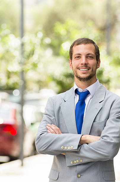 istock Handsome successful businessman professional in grey suit posing for camera 483141416