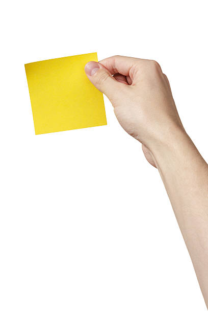 istock adult man hand holding sticky note 483146457