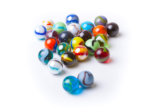 A collection of colorful marbles isolated on white background.