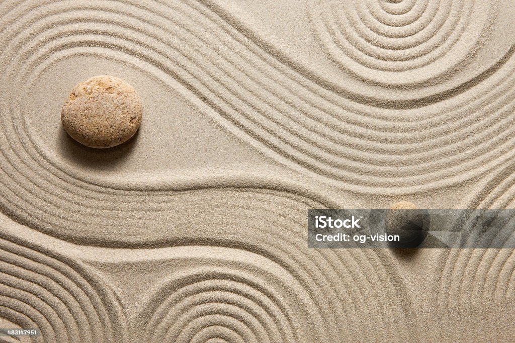 Zen garden Top view of raked sand with stones Zen-like Stock Photo
