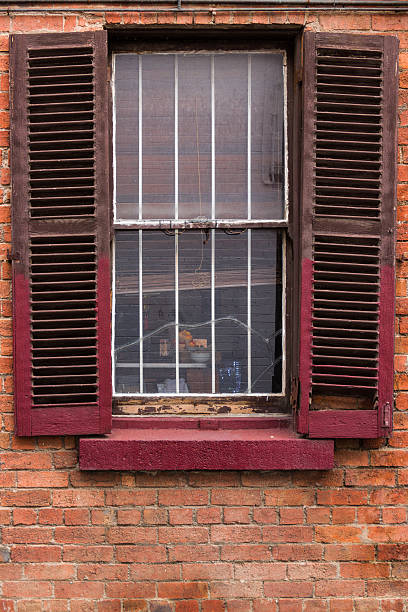 istock Window with Worn Out Wooden Shutters 483148362