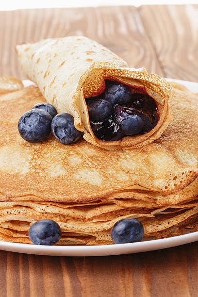 istock homemade blinis or crepes with blueberries and jam 483148947