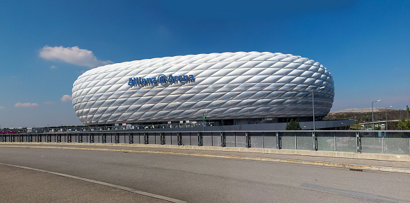 Munich, Germany - March 28, 2014: Exterior view of Allianz Arena football stadium, home stadium of FC Bayern Munich. The facade is constructed of 2,874 foil air panels. Build 2005 for 66.000 people. 