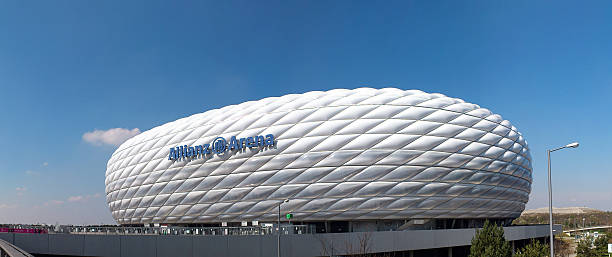 Allianz Arena Munich Munich, Germany - March 28, 2014: Exterior view of Allianz Arena football stadium, home stadium of FC Bayern Munich. The facade is constructed of 2,874 foil air panels. Build 2005 for 66.000 people.  allianz arena stock pictures, royalty-free photos & images