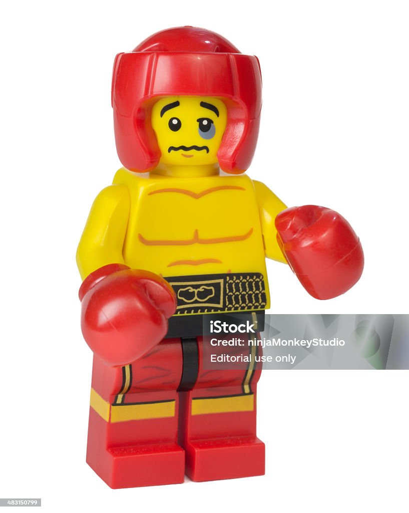 Boxer Lego Mini-figure Virginia, USA - June 8, 2013: Close-up of a Lego boxing figure from the company's Mini-figure Series 5, complete with boxing gloves and bruised eye. Lego is a famous brick toy produced by the Danish company Lego Group. They were first produced in 1978 Boxing - Sport Stock Photo