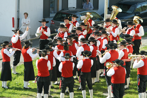 St Anton, Austria - May 4, 2008: A brass band dressed in traditional Austrian costume playing in the centre of St Anton during a cultural festival