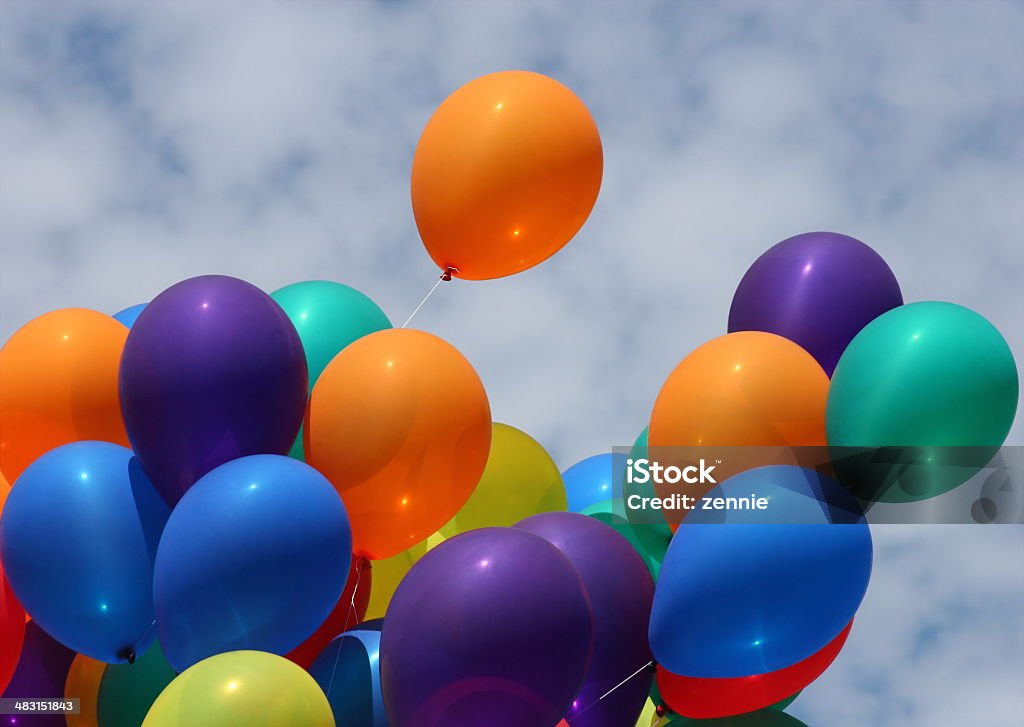 Blowing In The Wind Richly colored balloons blowing in the wind. Balloon Stock Photo