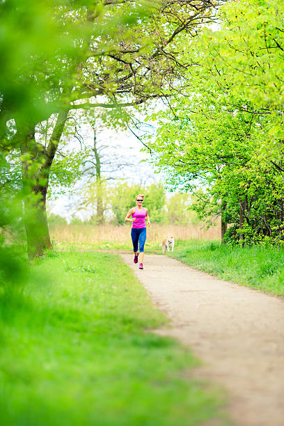 istock Woman runner running jogging in summer park 483155778