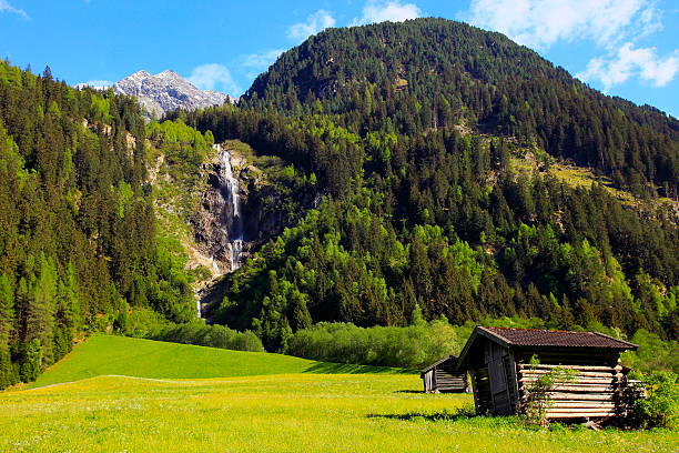 Alpine waterfall and chalet in Stubai near Innsbruck, Tirol, Austria Please, you can see in the link below my AUSTRIA Photo collection of Beautiful and dramatic mountains and landscapes of TIROL, GROSSGLOCKNER, HOHE TAUERN, ROFAN, ZILLERTAL, CARINTHIA, KARWENDEL, SALZBURGER LAND, and much more!! neustift im stubaital stock pictures, royalty-free photos & images