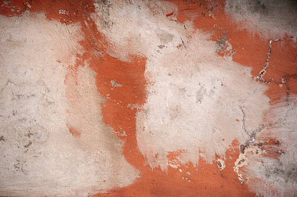 istock Texture of old wall covered with red stucco 483165154