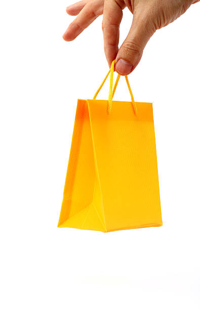 shopping einkaufstasche - shopping bag orange bag handle stock-fotos und bilder