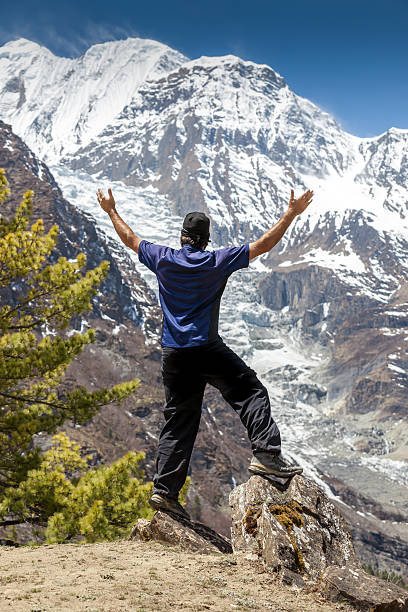 istock Man hiker with arms raised, Annapurna trek, Nepal 483166443
