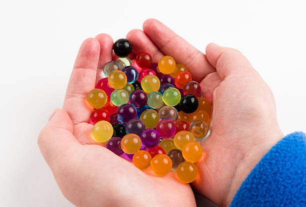 istock Hands Holding Round Colorful Balls 483166985