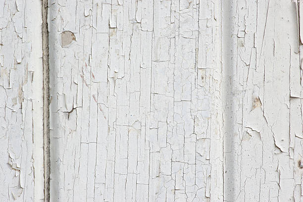 Texture of disintegration white paint on wood stock photo