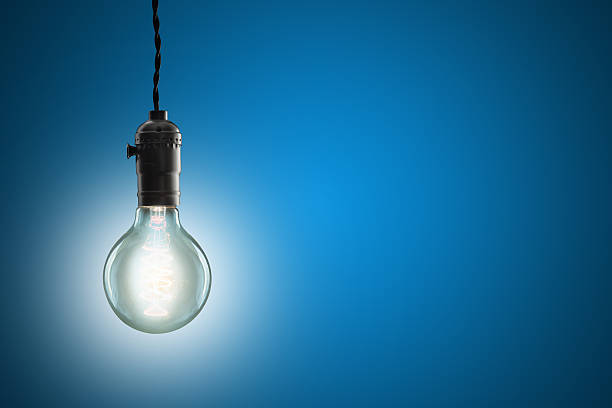 istock Idea concept - Vintage incandescent bulb on blue background 483167860