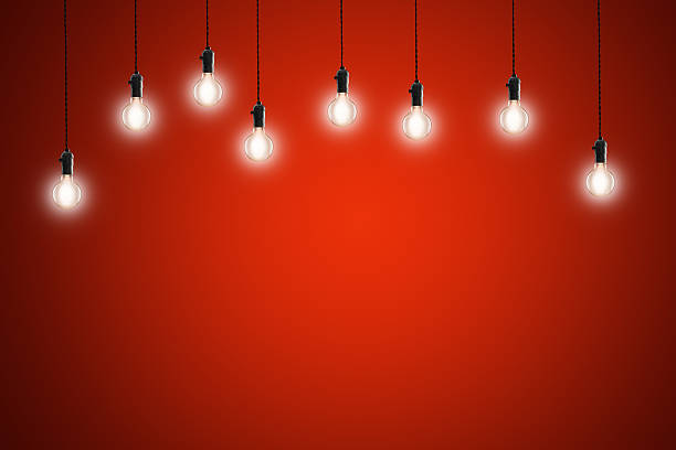 istock Idea concept - Vintage incandescent bulbs on red background 483167870