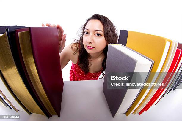 Young Female Student Browsing Books On A Bookshelf Stock Photo - Download Image Now - Adult, Beautiful People, Beautiful Woman