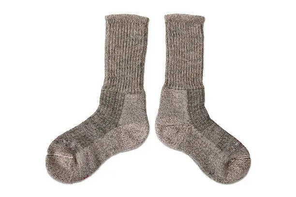 Close up of a pair of sports socks for men on a white background.