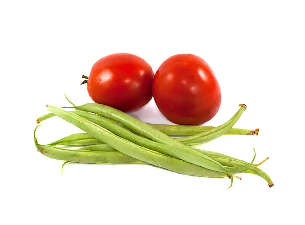 green beans with red tomatoes isolated on white background