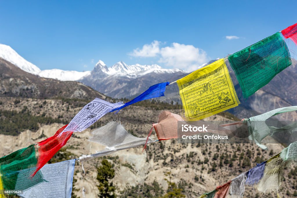 Tibetan Prayer Flags on Mountain Summit, Nepal Tibetan praying flags on mountain summit, Nepal Annapurna Conservation Area Stock Photo
