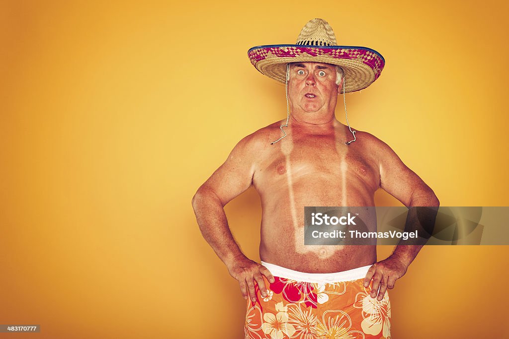 The Tourist - Cool Camera Sombrero Humor Hawaiian Tourist on yellow background. Sunburned Stock Photo