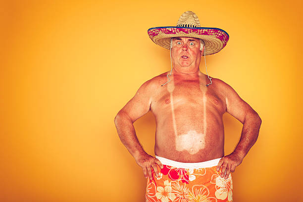 The Tourist - Cool Camera Sombrero Humor Hawaiian Tourist on yellow background. sunbathing photos stock pictures, royalty-free photos & images