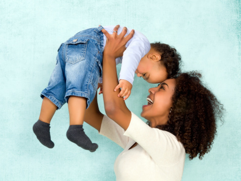 African mother playing with her 11 months old son