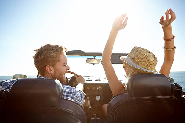 istock Smiling couple in a convertible on a sunny day 483171399
