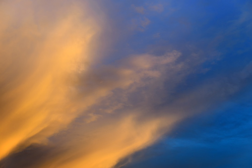 Background of the sky at sunset with clouds of brown, soft focus