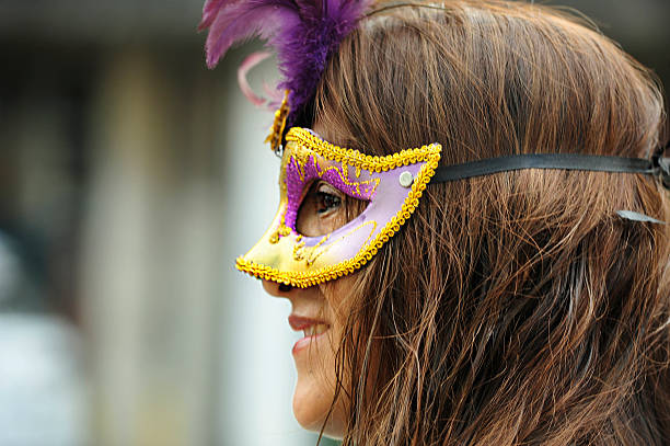 São Paulo, Brazil, March, 02, 2014: Woman immigrant from Bolivia using a mask dance during the celebration of Carnival in Kantuta Square in the city of São Paulo, Brazil. The square Kantuta is a traditional meeting point for Bolivian immigrants that came to Brazil in search of work in the garment industries
