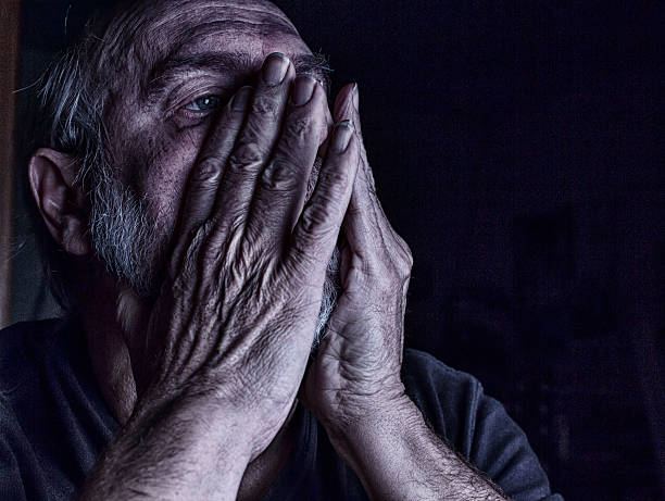 istock Depressed Tired Senior Man Holding Face In Hands 483172285