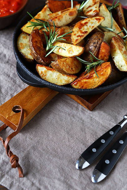 istock Delicious baked potato slices 483172940