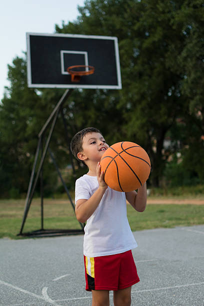 istock Father and son playing basketball 483175922