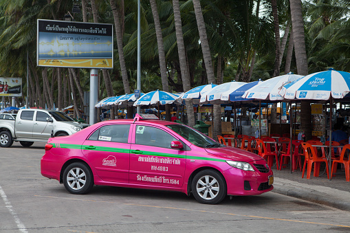 Pattaya, Thailand - July 18, 2015: A colorful taxi parking on the car park area on the street of Pattaya beach and waiting for passenger. Pattaya is a town on Thailand eastern Gulf coast.