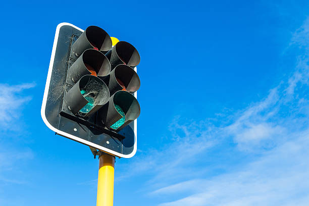 istock The traffic lights and little cobweb against blue sky background. 483177228