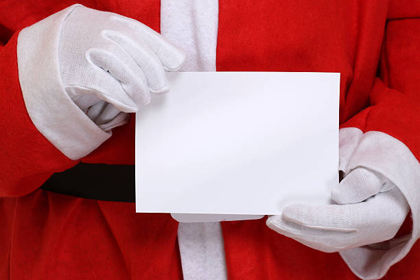 istock Santa Claus holding empty Christmas card with copyspace 483179016