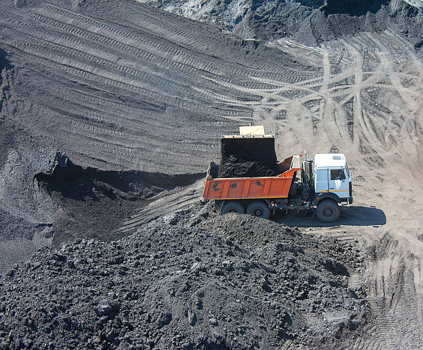 istock Truck on the loading of coal in coal mine 483179262